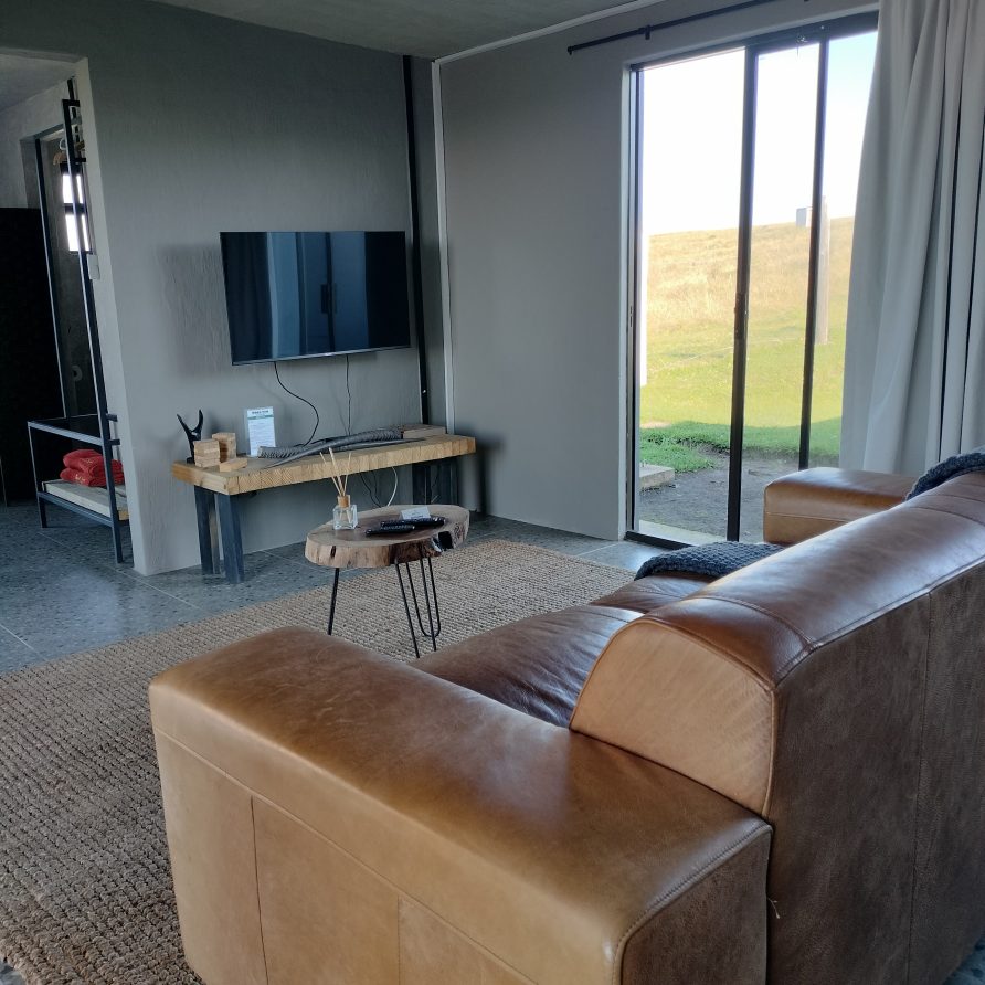 Watching tv from the lounge in mapuzi pozi in coffee bay